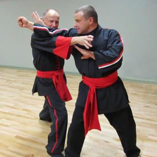 Masters Mike Kazakoff and DJ Swanstrom demonstrating a technique in class